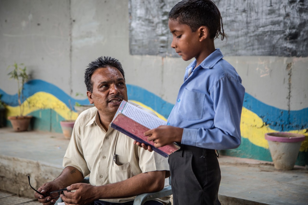 Rajesh Kumar Sharma, a grocery store owner in Delhi’s Shakarpur area, has been teaching poor children in his open-air free school under a Delhi Metro bridge near the Yamuna Bank Metro depot for the last five years.